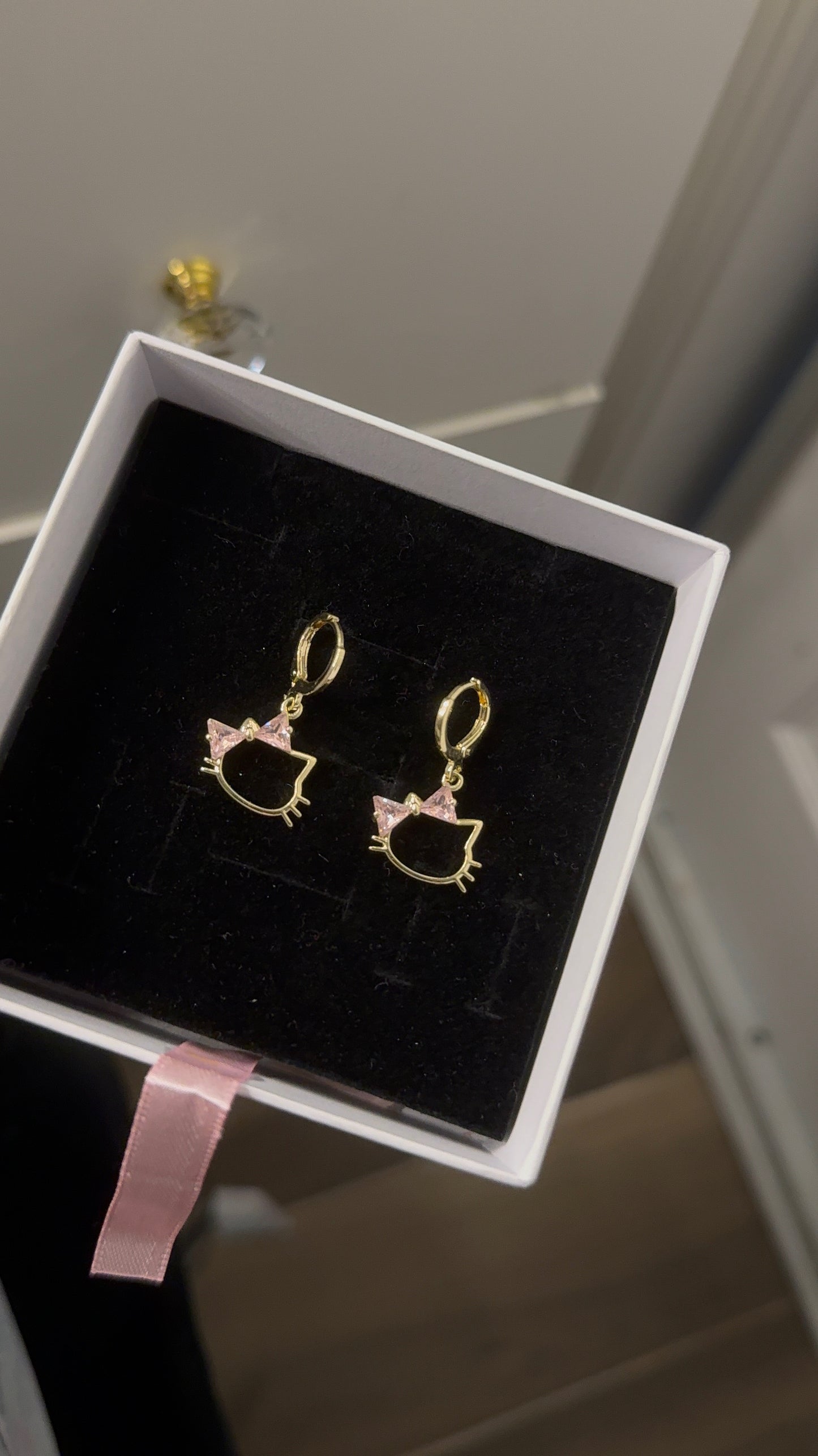 Pink HK Huggie earrings