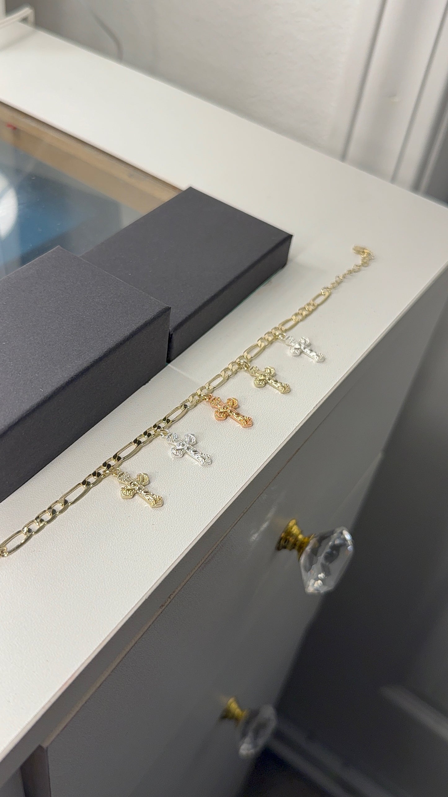 Figaro bracelet with cross charms