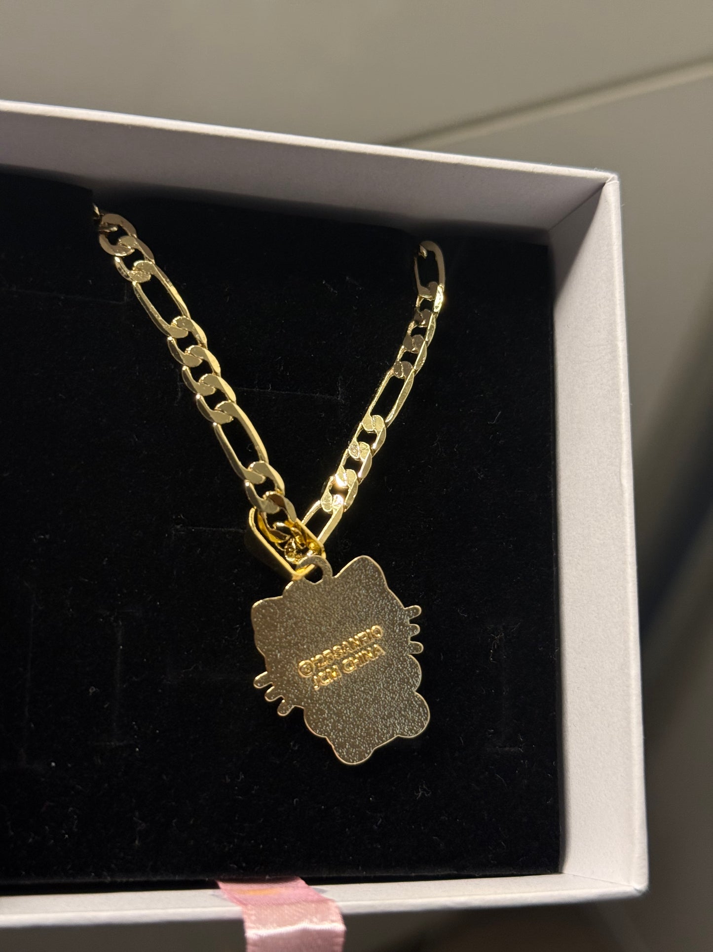 Gold plated hk pendant with figaro chain