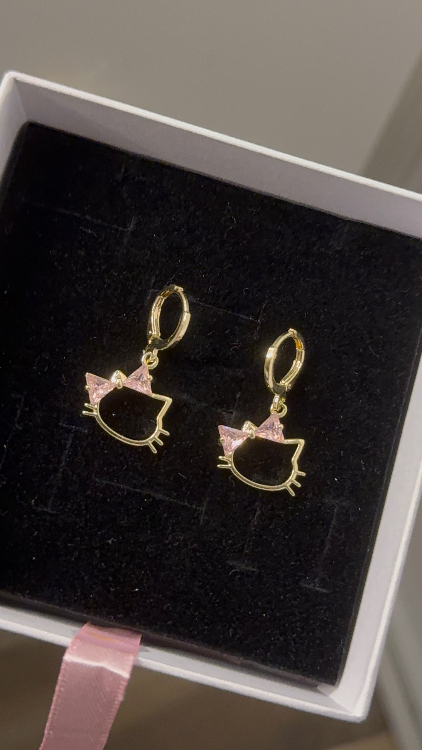 Pink HK Huggie earrings